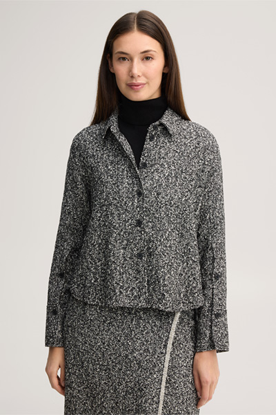 Leads to product detail page "Virgin wool tweed shirt in black and white"