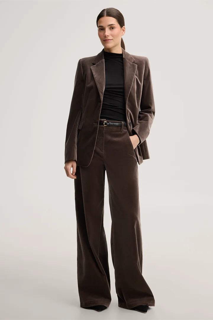 Leads to product detail page "Black lyocell stretch jumper with a stand-up collar"