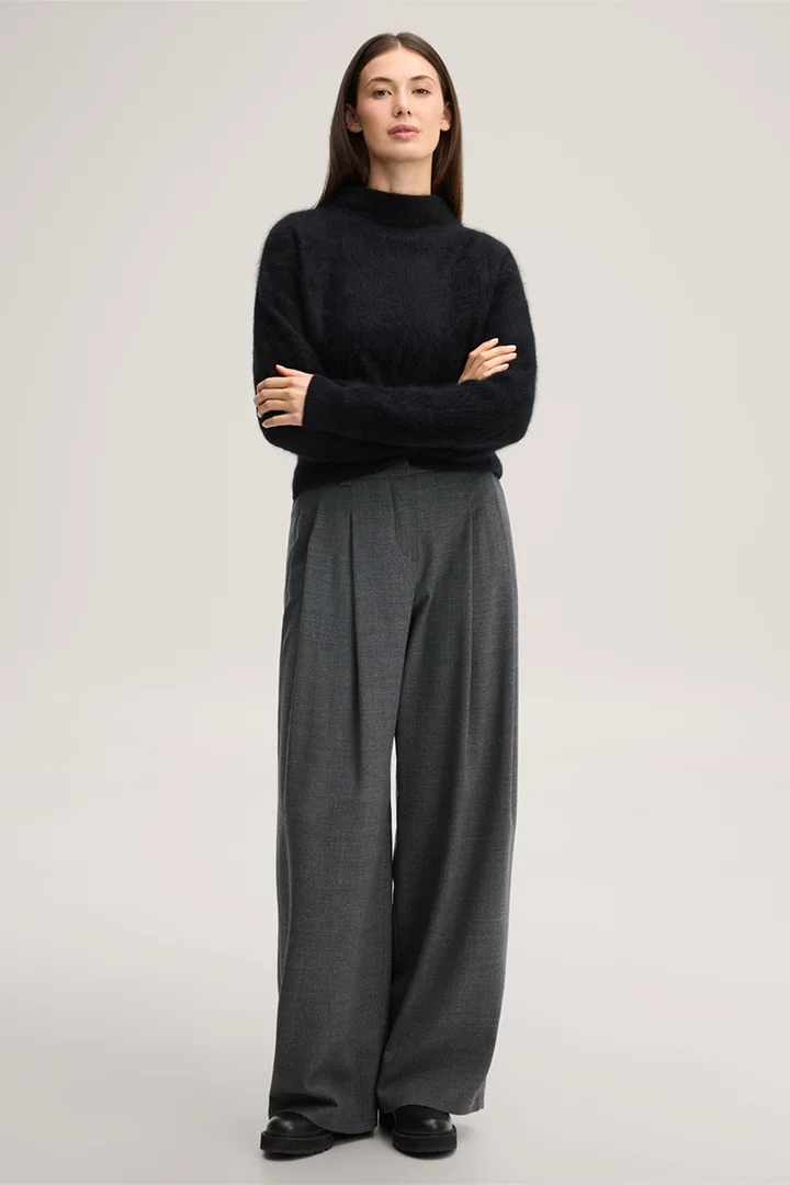 Leads to product detail page "Brushed cashmere jumper with a stand-up collar in black"