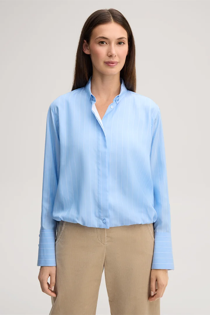 Leads to product detail page "Cropped lyocell shirt in light blue and white stripes"