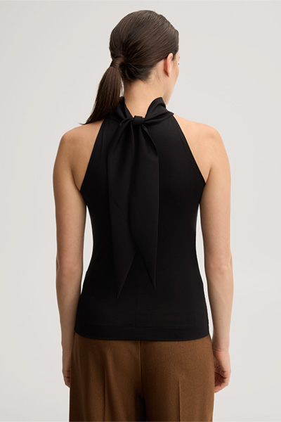 Leads to product detail page "Black lyocell stretch top with a stand-up collar"