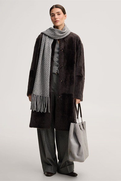 Leads to product detail page "Reversible lambskin coat in dark brown"