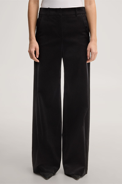 Leads to product detail page "Black velvet palazzo trousers"