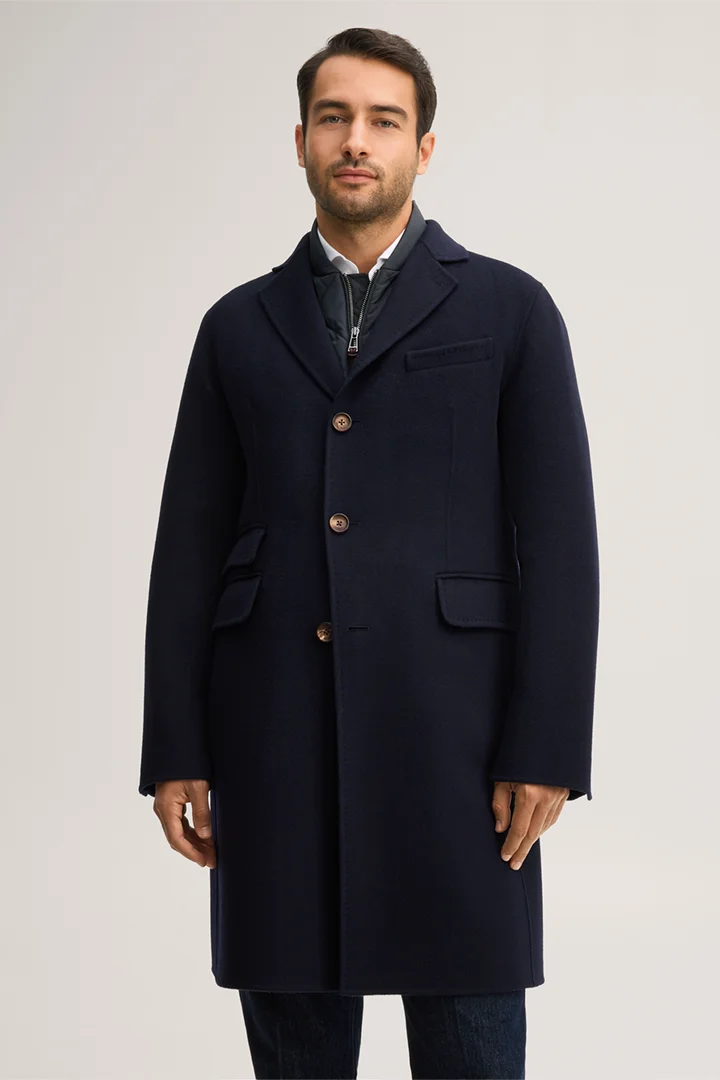 Leads to product detail page "Double-faced woollen coat with lapels in navy blue"