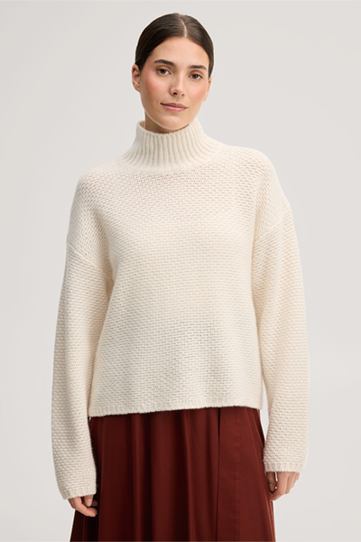 Führt zu Produktdetailseite „Cashmere-Stehkragen-Pullover in Ecru"