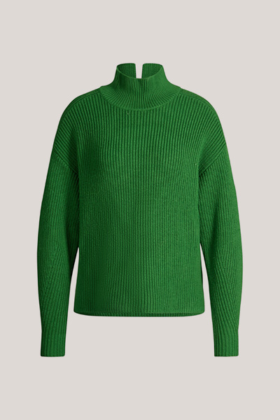 Leads to product detail page "Green merino wool jumper with a stand-up collar"