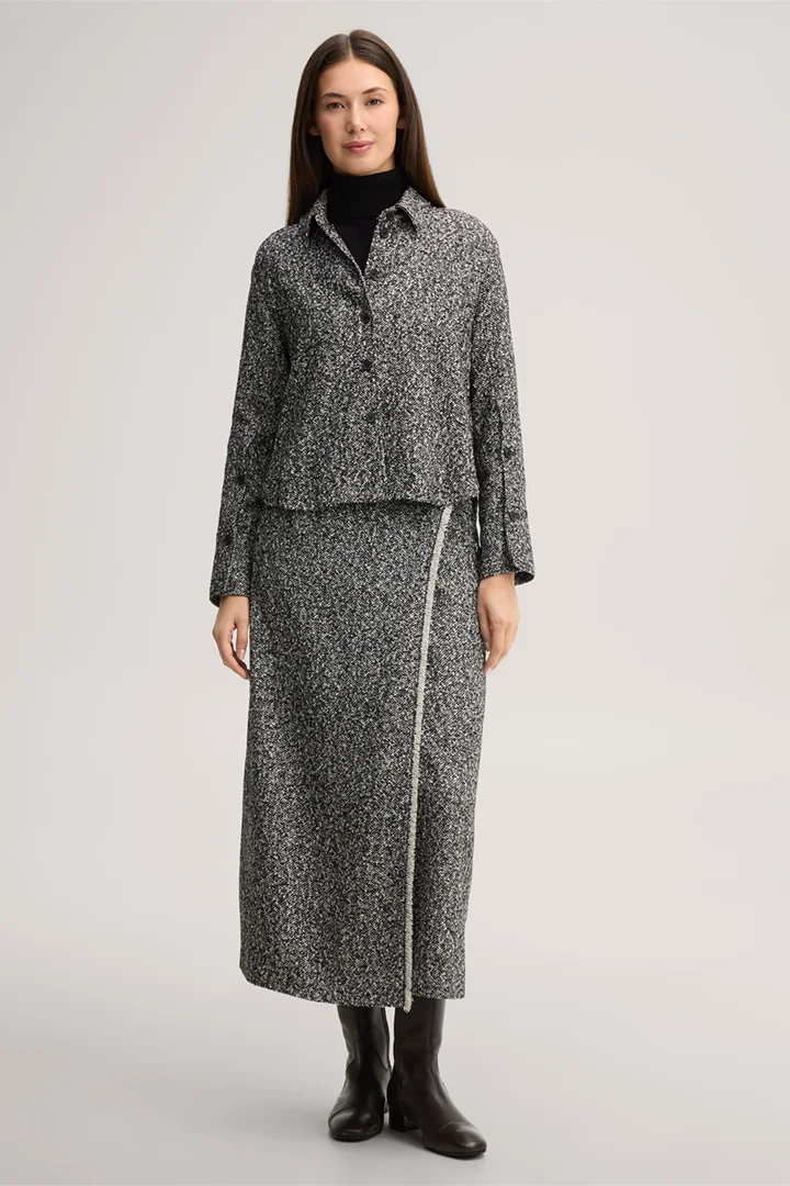 Leads to product detail page "Virgin wool tweed shirt in black and white"