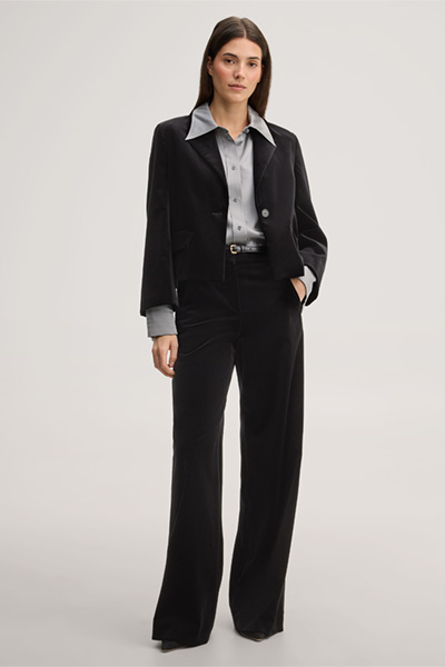 Leads to product detail page "Black velvet palazzo trousers"