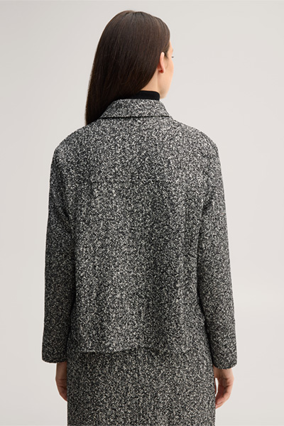 Leads to product detail page "Virgin wool tweed shirt in black and white"