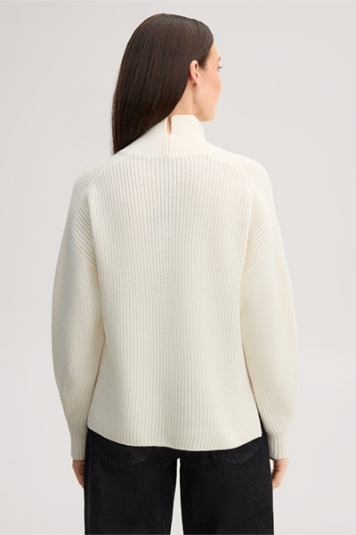 Leads to product detail page "Ecru merino wool jumper with a stand-up collar"