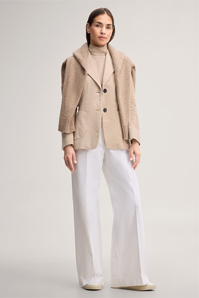 Leads to product detail page "Beige corduroy blazer"