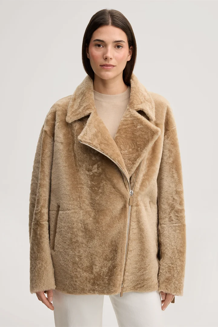Leads to product detail page "Beige lambskin biker jacket with zip"