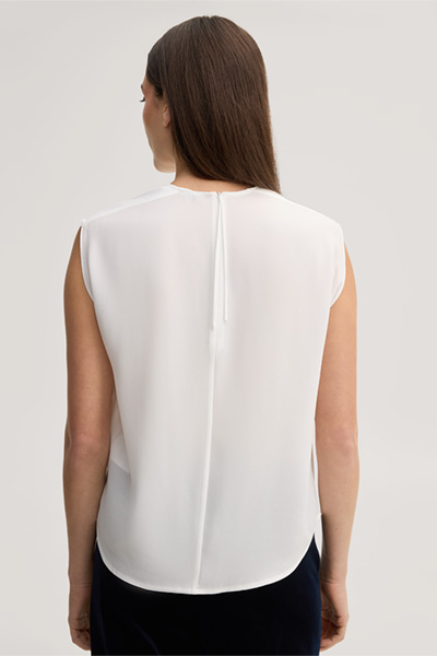 Leads to product detail page "Ecru crepe blouse top"