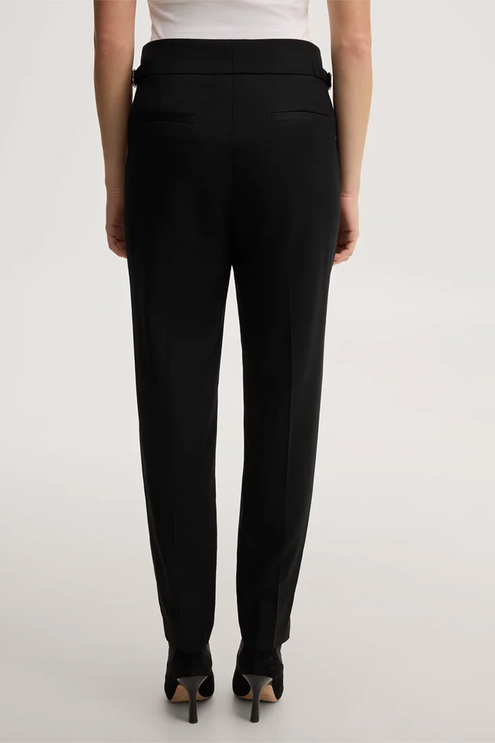 Leads to product detail page "Black virgin wool flannel pleated trousers"