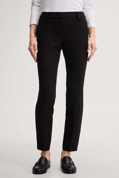 Leads to product detail page "Black crêpe cigarette pants"