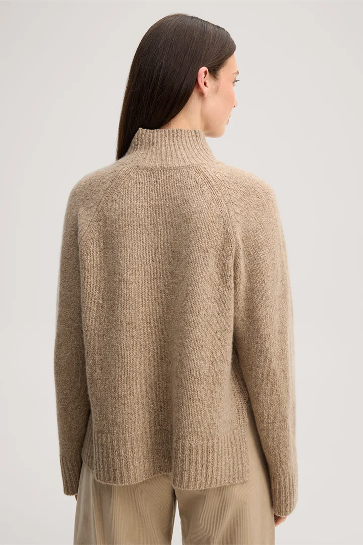 Leads to product detail page "Beige tweed and cashmere stand-up collar jumper"