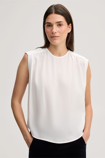 Leads to product detail page "Ecru crepe blouse top"