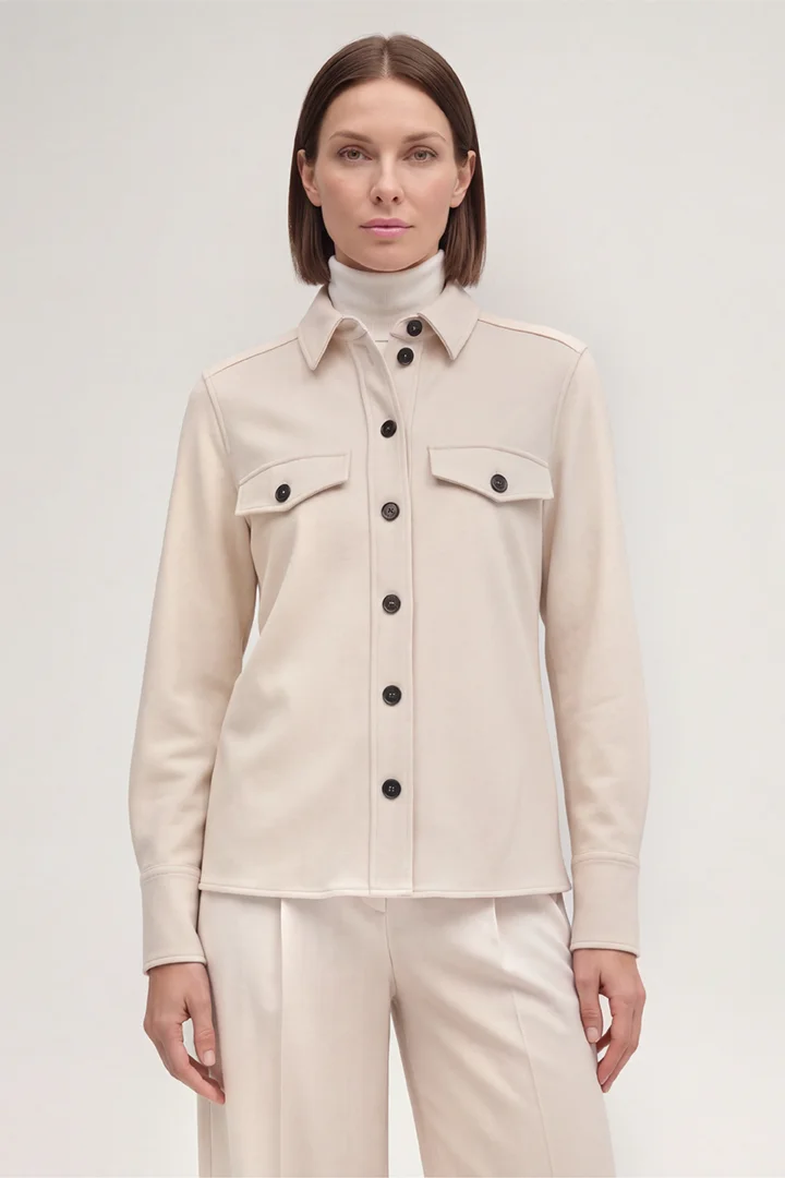 Leads to product detail page "Wool Jersey Shirt-style Blouse in Light Beige"