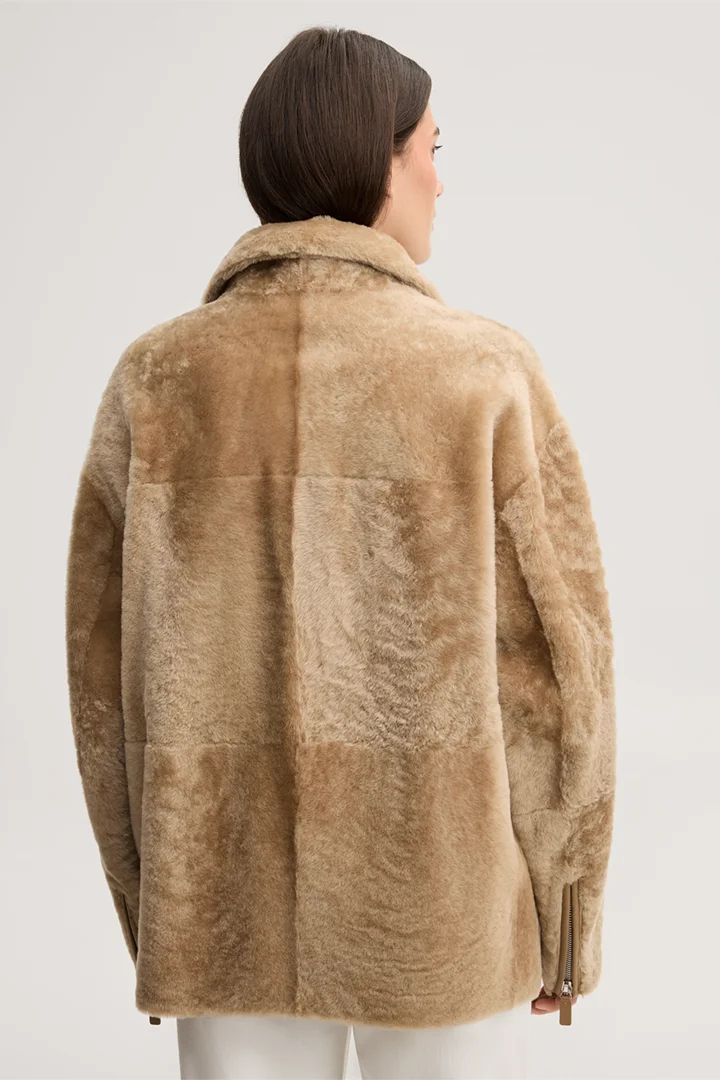 Leads to product detail page "Beige lambskin biker jacket with zip"
