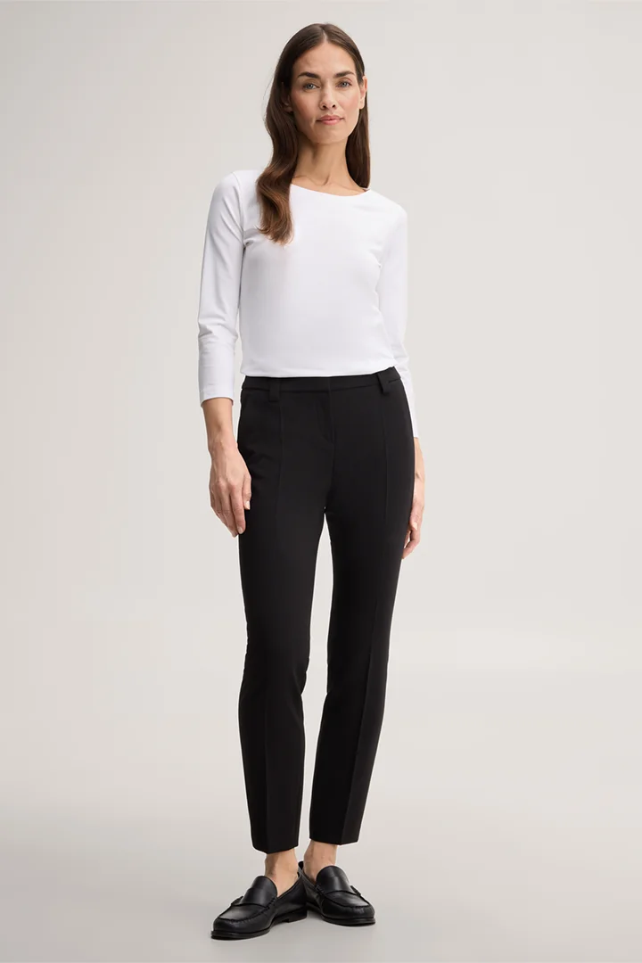 Leads to product detail page "Black crêpe cigarette pants"