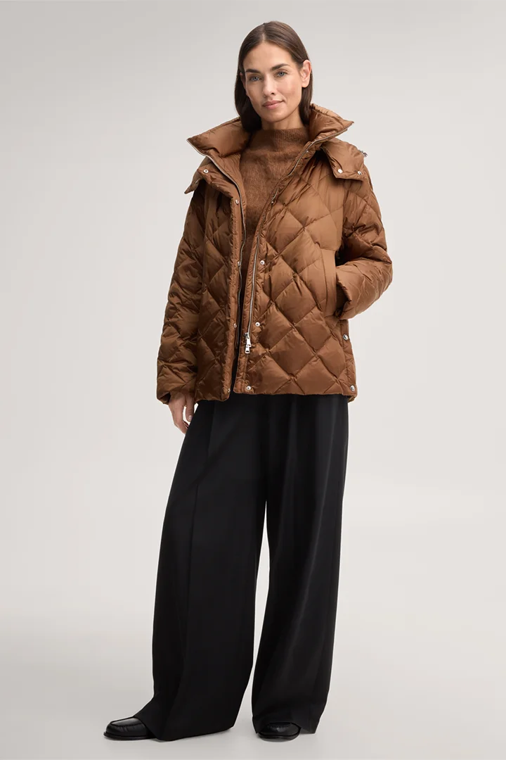 Leads to product detail page "Nylon quilted jacket with a stand-up collar in caramel"