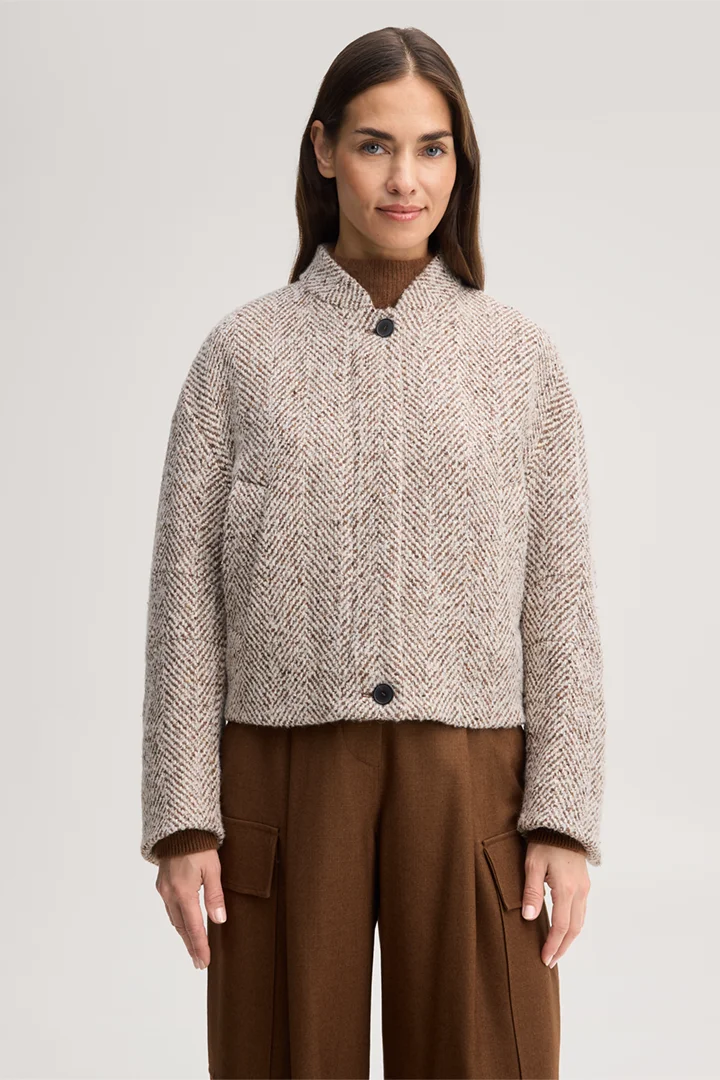 Leads to product detail page "Wool-blend tweed jacket in herringbone ecru, brown and grey"