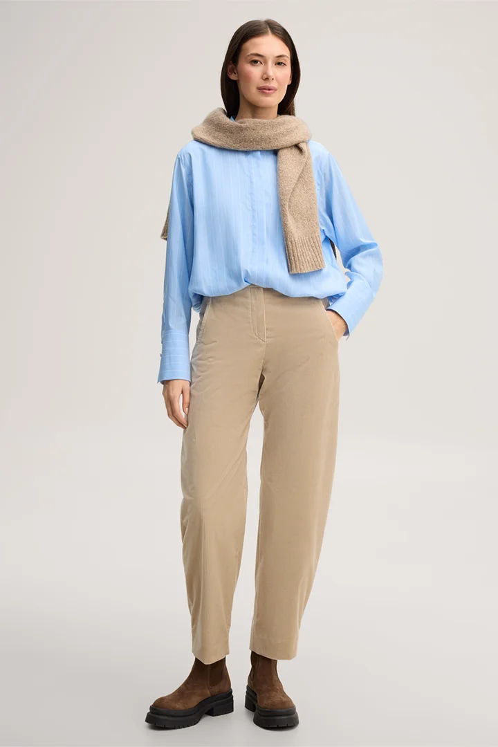 Leads to product detail page "Cropped lyocell shirt in light blue and white stripes"