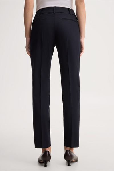 Leads to product detail page "Navy blue virgin wool stretch cigarette pants"