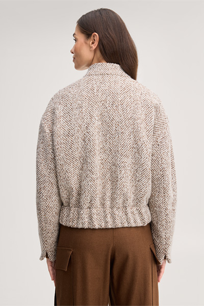 Leads to product detail page "Wool-blend tweed jacket in herringbone ecru, brown and grey"