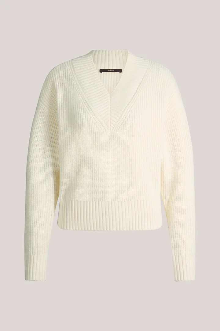 Leads to product detail page "Ecru merino knit jumper with a V-neck"