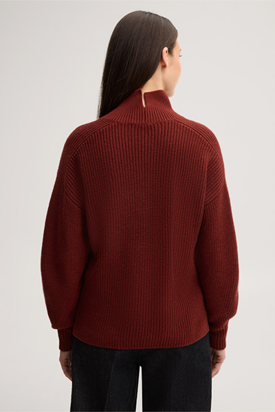Leads to product detail page "Dark red merino woollen jumper with a stand-up collar"