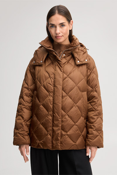Leads to product detail page "Nylon quilted jacket with a stand-up collar in caramel"