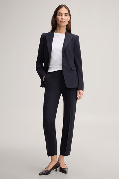 Leads to product detail page "Navy blue virgin wool stretch cigarette pants"