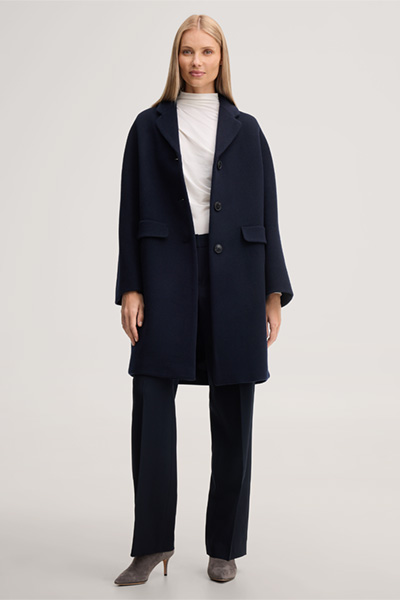 Leads to product detail page "Brushed wool short coat in navy blue"