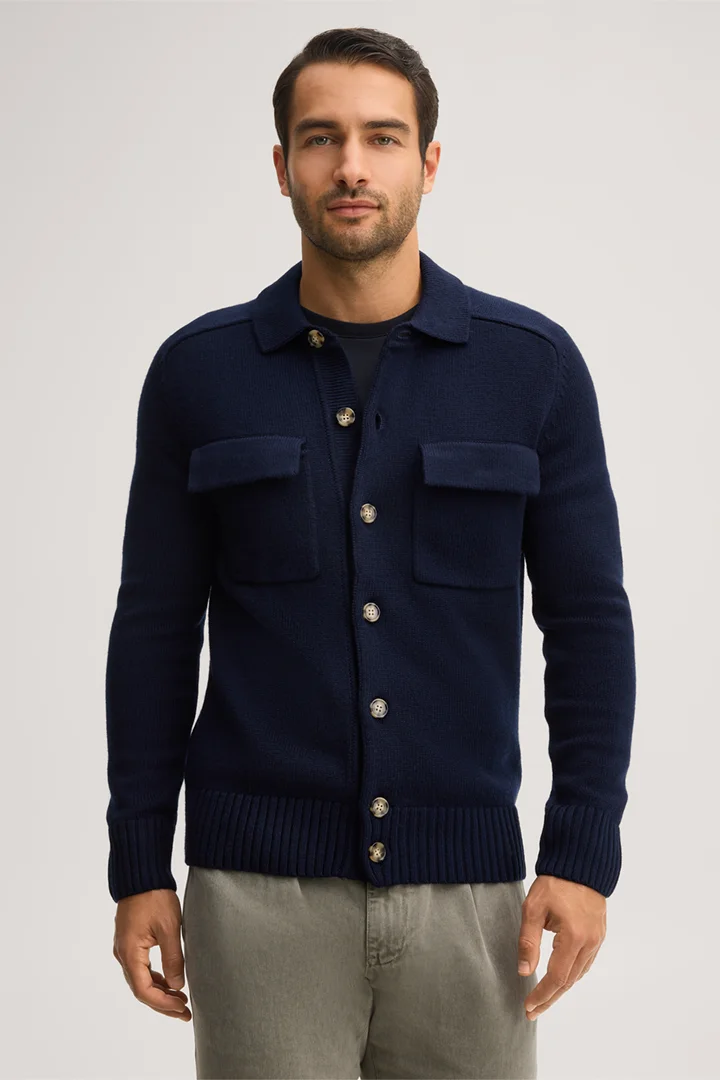 Leads to product detail page "Navy blue virgin wool knitted overshirt with a shirt collar"