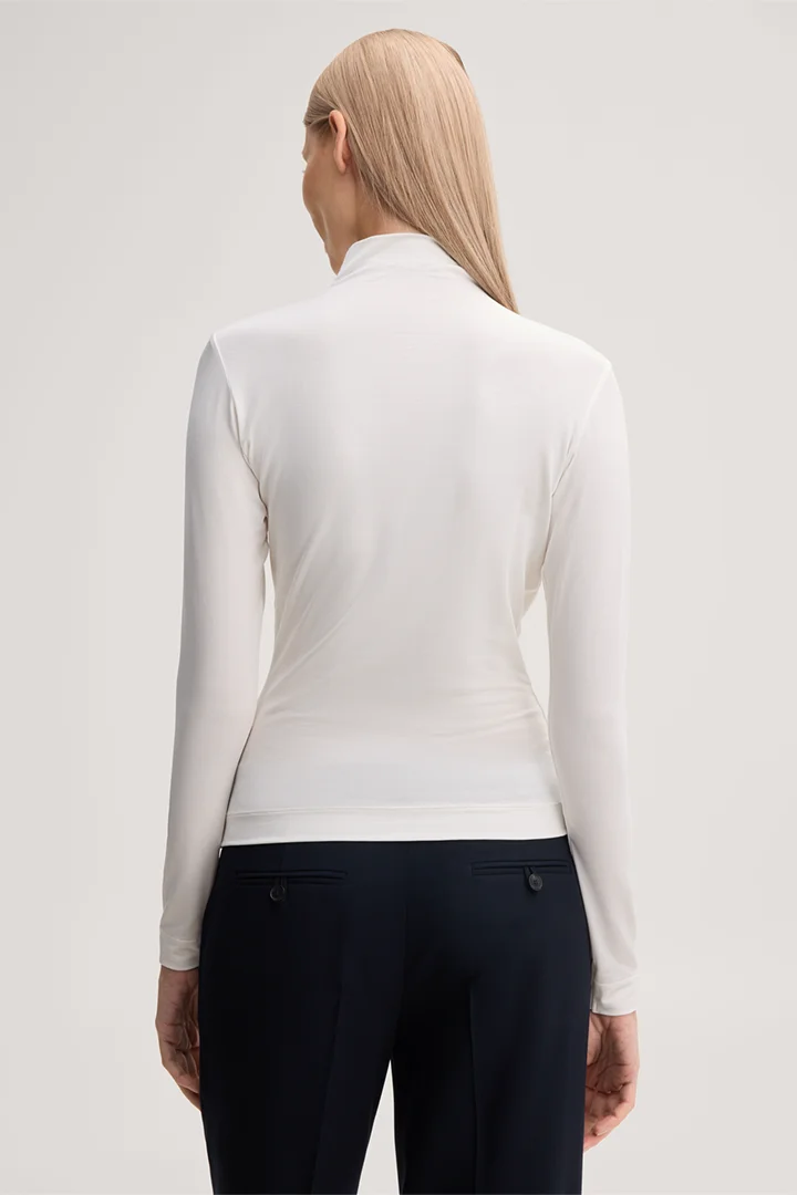 Leads to product detail page "Lyocell stretch jumper with a stand-up collar in ecru"