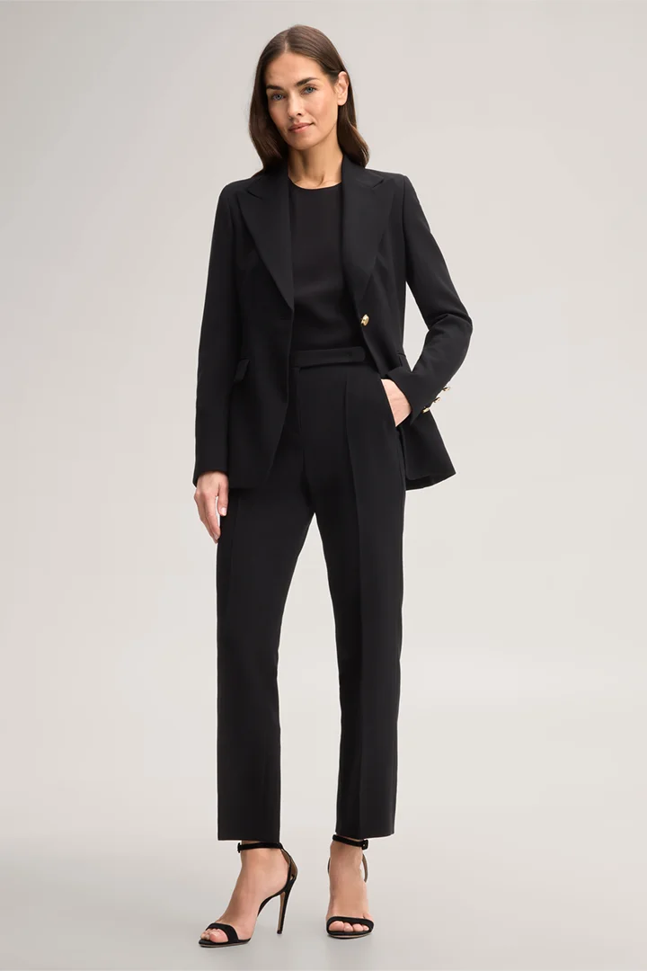 Leads to product detail page "Black wool crepe straight cut trousers"