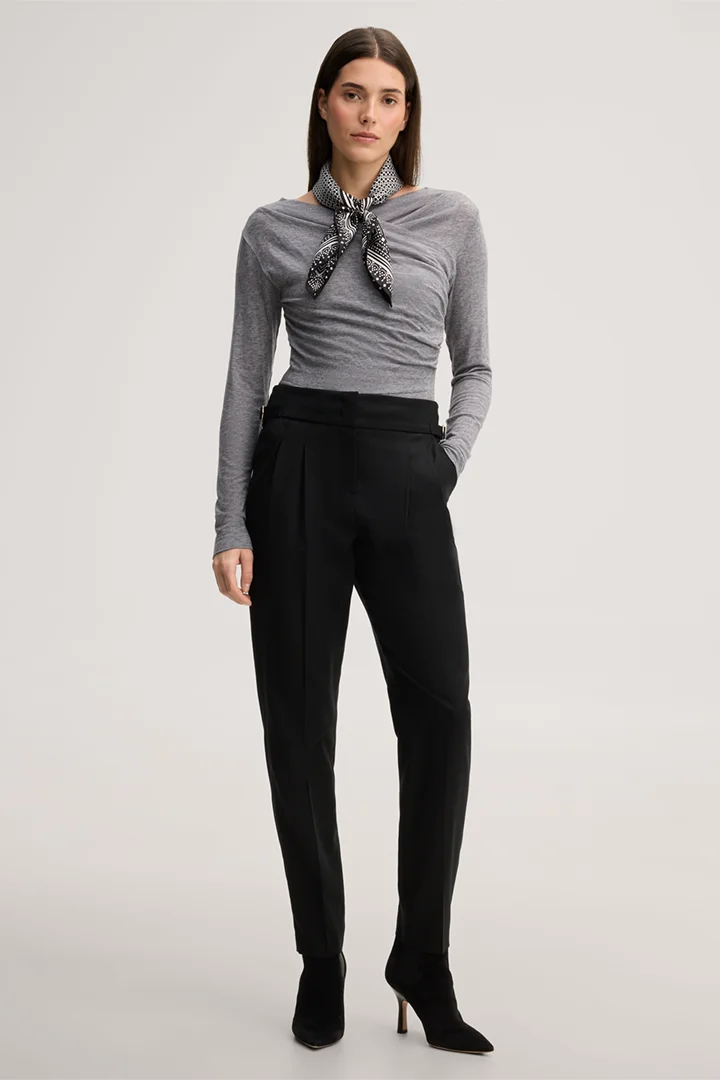 Leads to product detail page "Black virgin wool flannel pleated trousers"