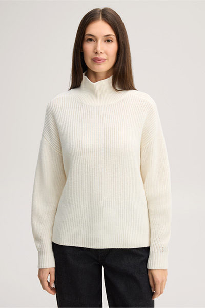 Leads to product detail page "Ecru merino wool jumper with a stand-up collar"