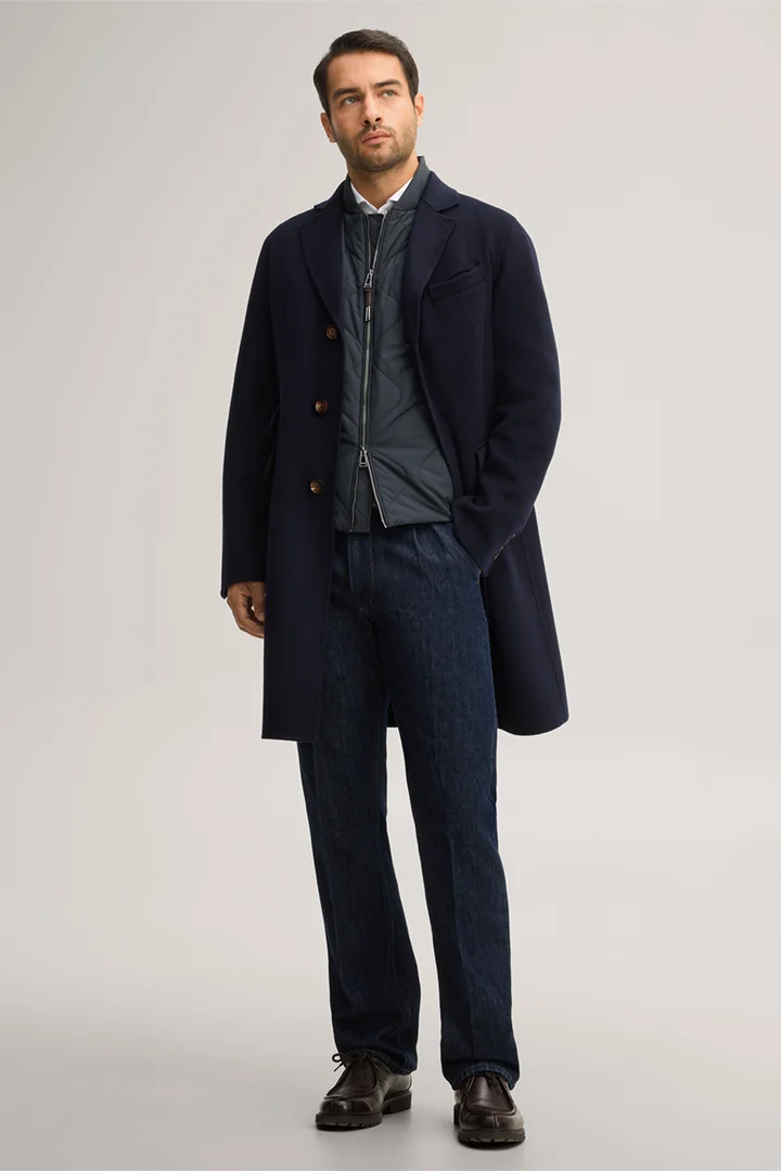 Leads to product detail page "Double-faced woollen coat with lapels in navy blue"