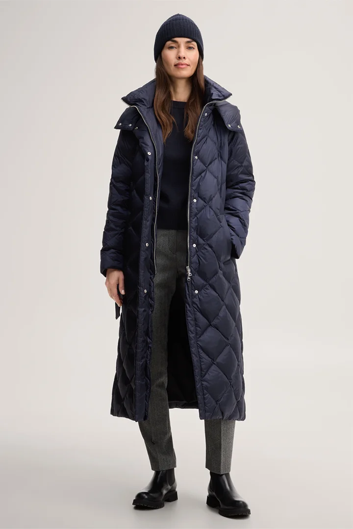 Leads to product detail page "Nylon down-filled quilted coat with stand-up collar in navy blue"