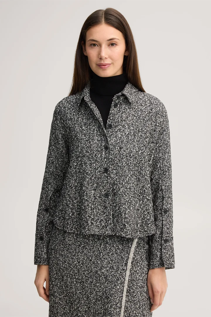 Leads to product detail page "Virgin wool tweed shirt in black and white"