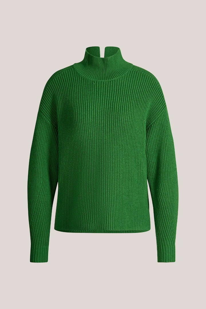 Leads to product detail page "Green merino wool jumper with a stand-up collar"