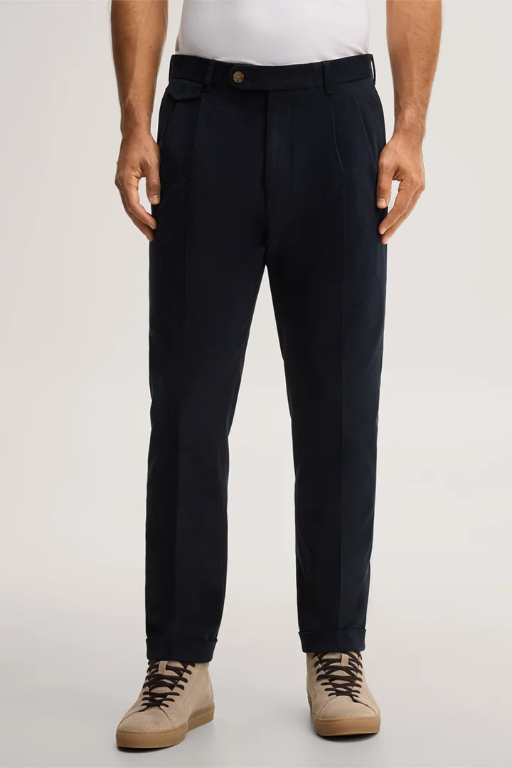 Leads to product detail page "Cotton pants with pleats in navy"