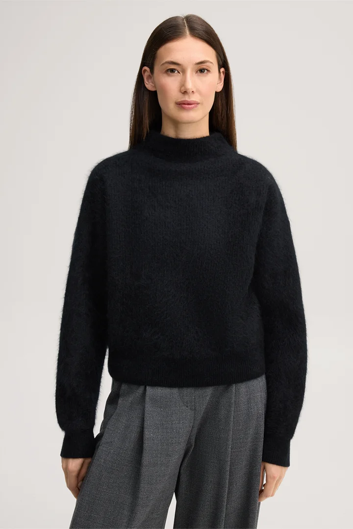 Leads to product detail page "Brushed cashmere jumper with a stand-up collar in black"