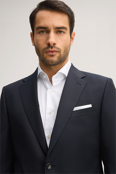 Leads to product detail page "Navy blue marl virgin wool suit"