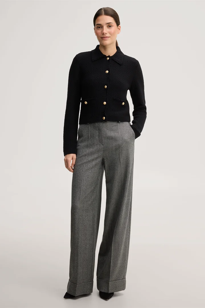 Leads to product detail page "Black fringed tweed knitted cardigan"