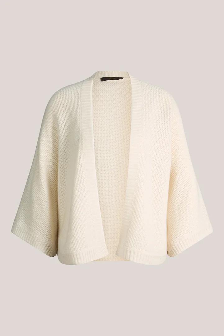 Leads to product detail page "Ecru cashmere cape"