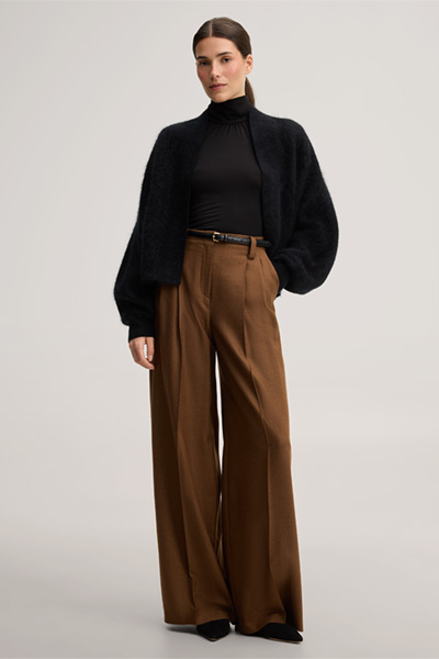 Leads to product detail page "Brushed cashmere cape jacket in black"