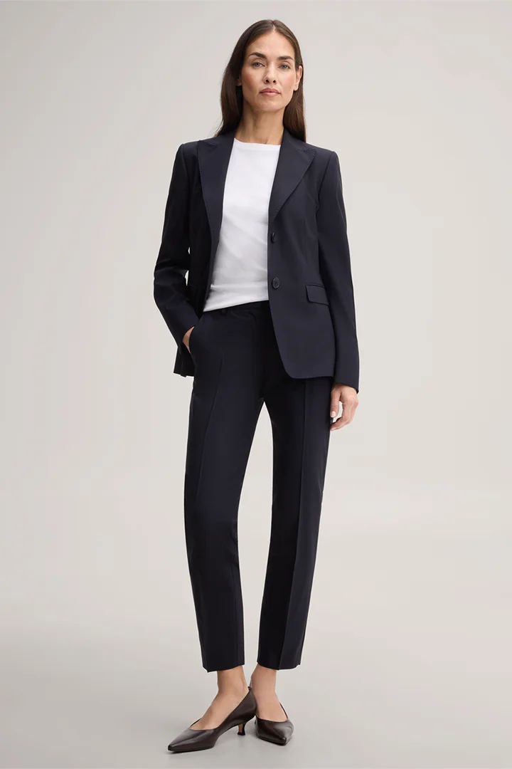 Leads to product detail page "Navy blue virgin wool stretch cigarette pants"